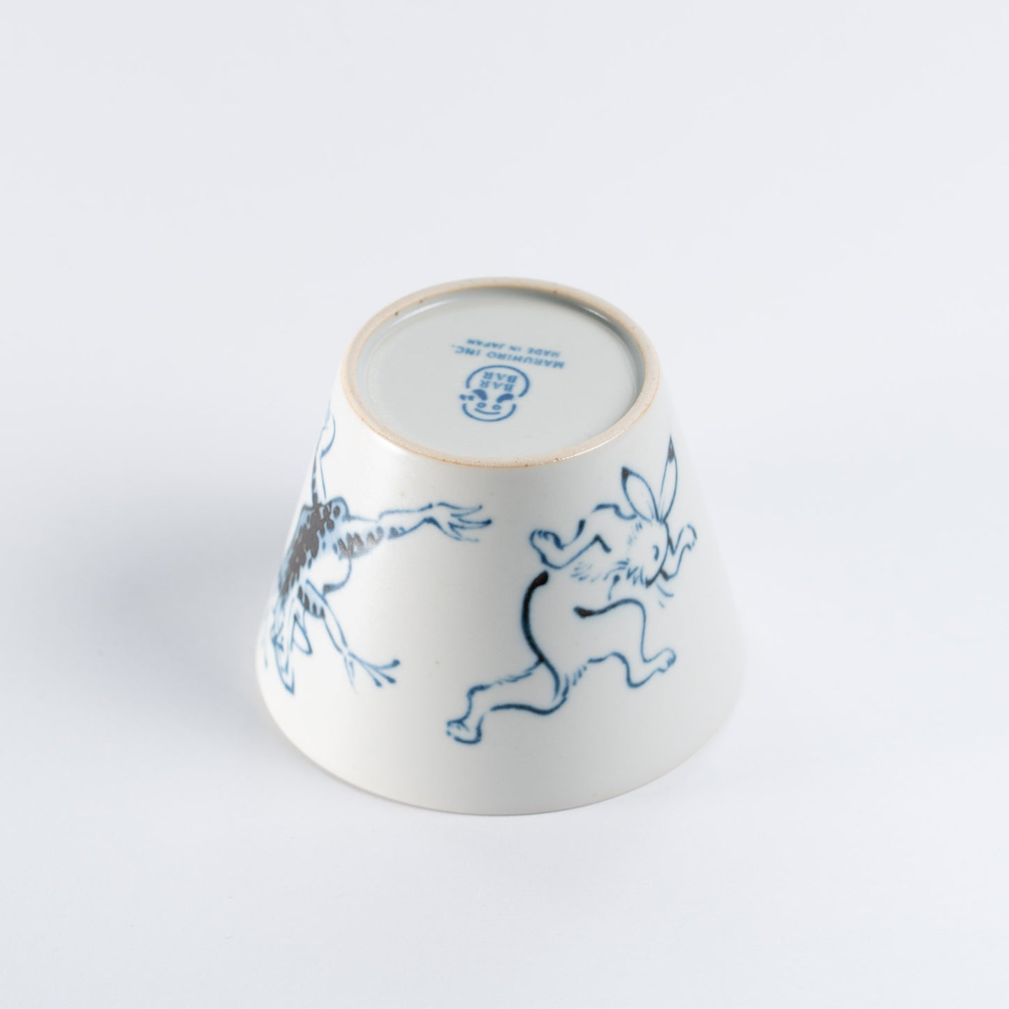 upside down mug - rabbit being tossed by the frog