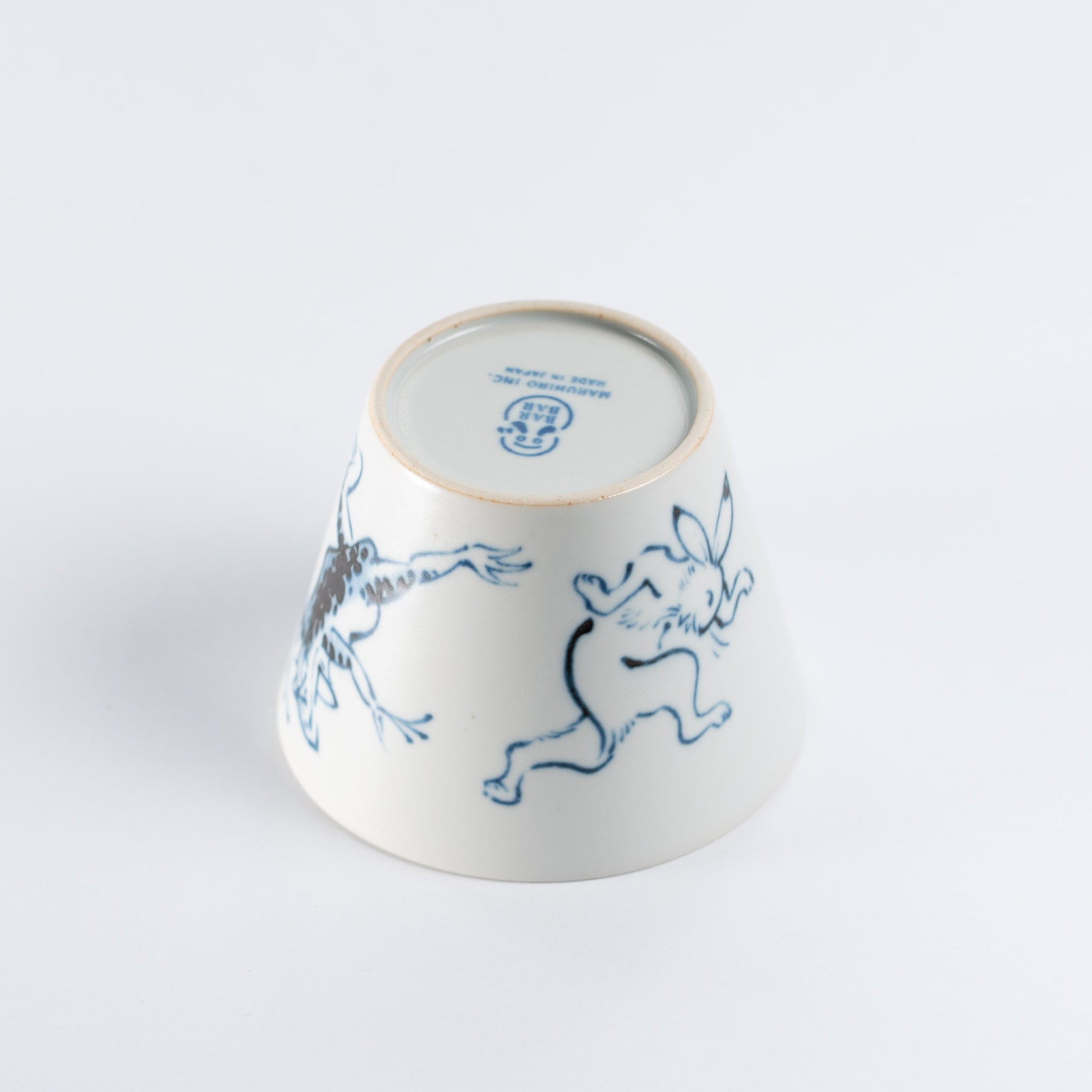 upside down mug - rabbit being tossed by the frog